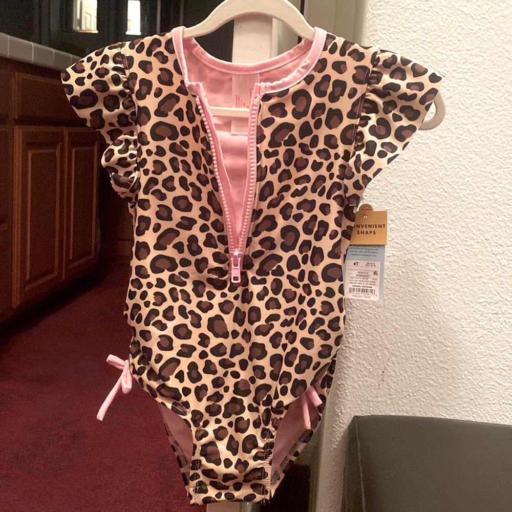 Animal print one piece swim wear. Zipper on chest brand new with tags